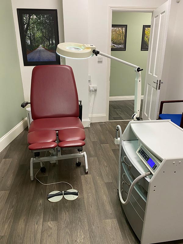 graphic image of a patient sitting in podiatry chair